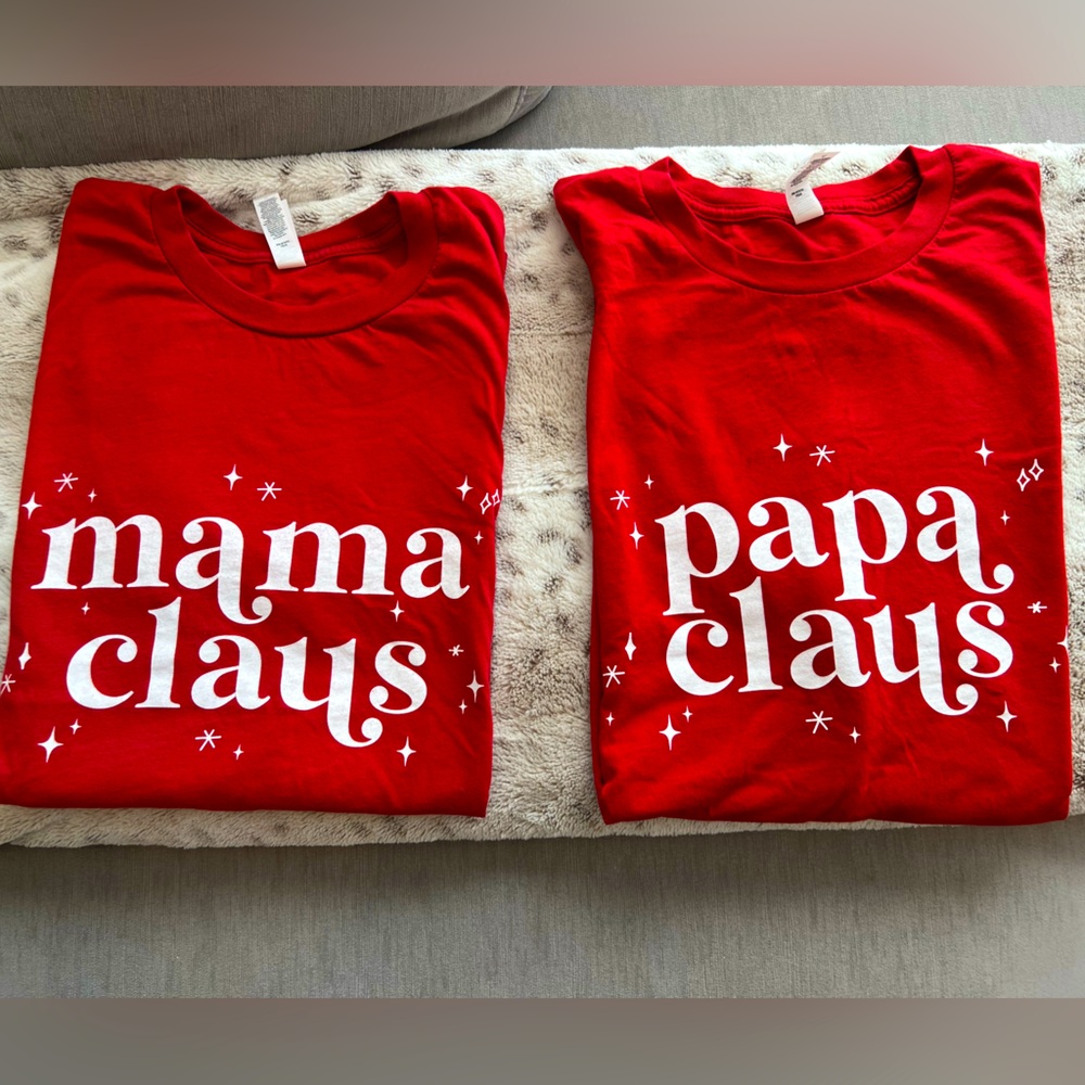 Matching mama claus and papa clause crew neck short sleeved tshirts.